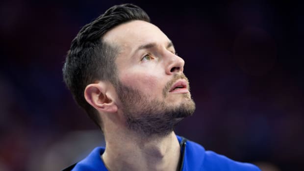 Former NBA player JJ Redick looks up.